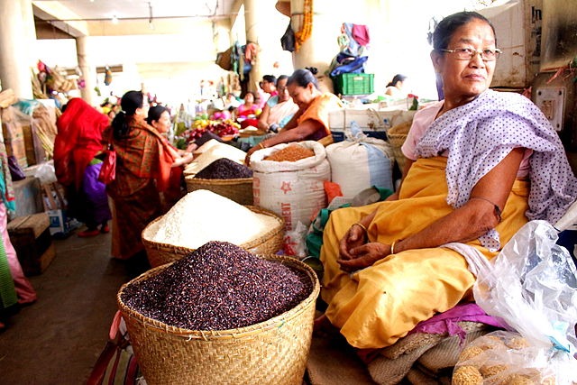 An Eema selling glutinous rice at Eema Bazaar. Glutinous rice is used in Manipur for preparing various dishes such as kheer, sweetdishes, changlhah etc. Location - Eema Bazaar, Imphal, Manipur. (Eema - Mother, Eema Bazaar - a bazaar in Imphal "manned" exclusively by women.)